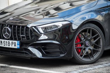  red brake on disc on black Mercedes AMG Parked in the street