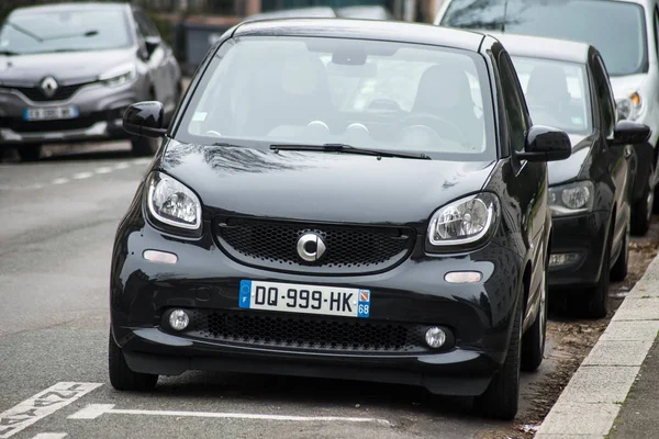 Front view of black smart car parked in the street — 스톡 사진