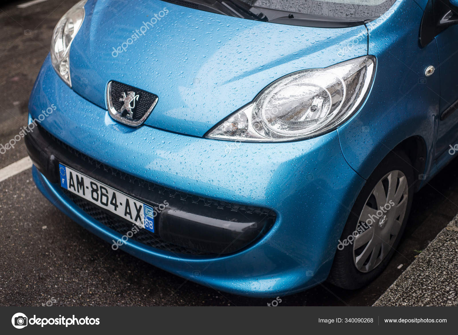 Front view of blue Peugeot 106 parked in the street by rainy day – Stock  Editorial Photo © NeydtStock #340090268