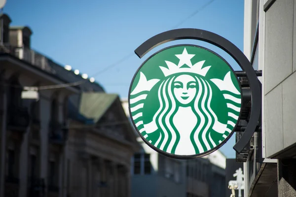 Starbucks logo on signboard on fast food front in the street — 스톡 사진