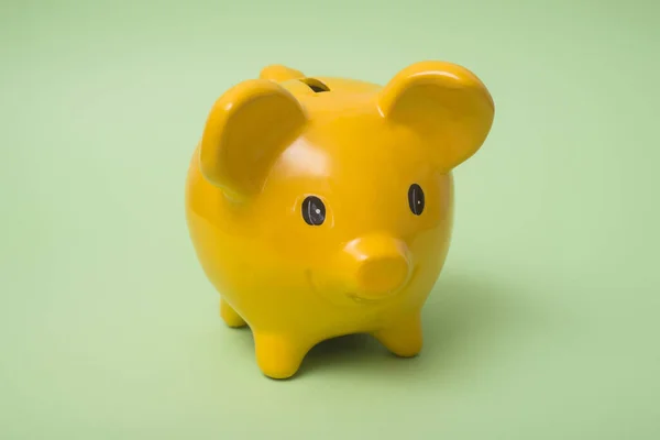 Closeup Yellow Piggy Bank Green Background — Stock Photo, Image