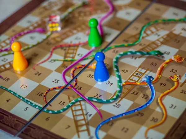 Closeup image of a Snakes and Ladders game