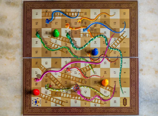 Closeup image of a Snakes and Ladders game