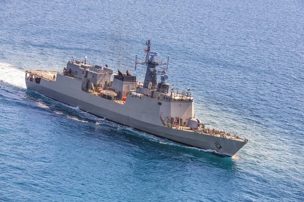 Military navy ships in a sea bay view from helicopter