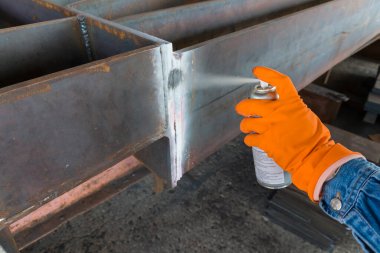 The step fourth of doing penetrant testing is step to use Developer spray into the welded to pull the liquid penetrate from the defect for Non-Destructive Testing with process Penetrant Testing(PT) clipart