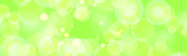 緑の背景に多色のぼやけたボケ パノラマ — ストック写真
