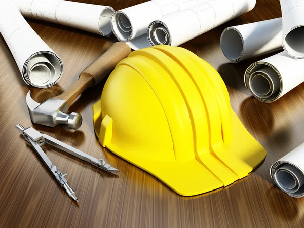 Construction blueprints, hardhat and tools on the table — Stockfoto