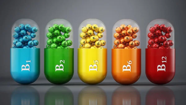 Diverse vitamine B pillen staan op donkergrijze achtergrond. 3d illustratie — Stockfoto