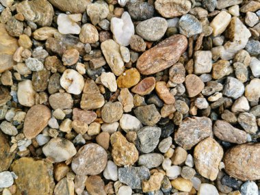 Çakıl taşlarının arka planının üst görüntüsü. Nehir taşları manzarası