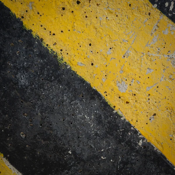 Noir et jaune panneau de signalisation arrière-plan — Photo