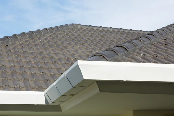 Gutter on roof top residential building house — Stock Photo, Image