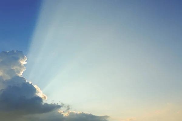 Light rays explosion on clear blue sky with cloud — Stock Photo, Image