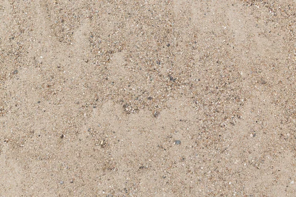 Коричневый песок с мелким гравием — стоковое фото
