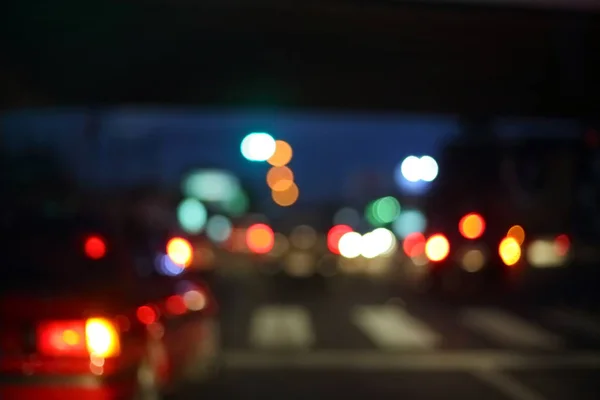 Traffic light of driving car on city night street road — Stock Photo, Image