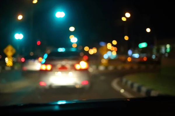 Traffic light of driving car on city night street road — Stock Photo, Image