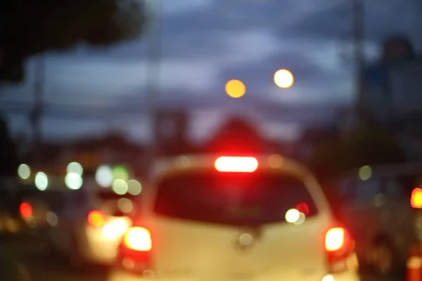 Traffic light of driving car on city night street road — Stock Photo, Image