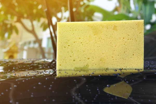 Yellow sponge used car wash — Stock Photo, Image