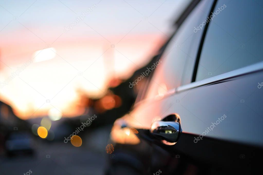 luxury vehicle black car with blur twilight dramatic sky