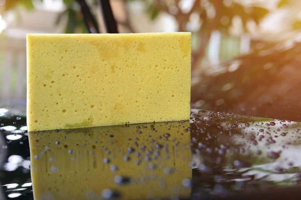 Yellow sponge used car wash — Stock Photo, Image