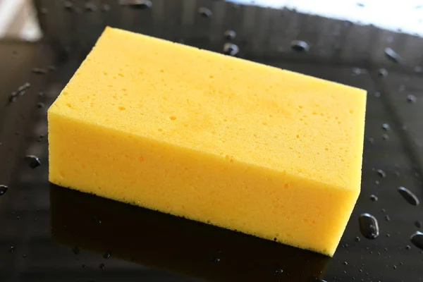 Yellow sponge used car wash — Stock Photo, Image