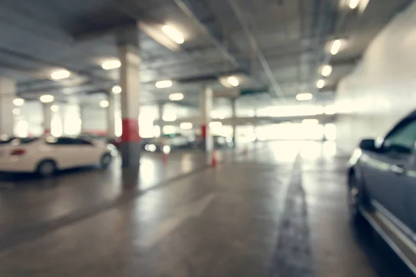 Abstrato parque de estacionamento embaçado no edifício — Fotografia de Stock