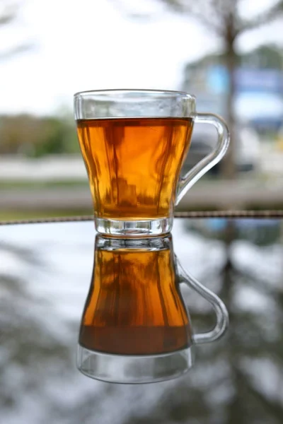 Hot tea healthy drink put on glass table in the morning time — Stock Photo, Image