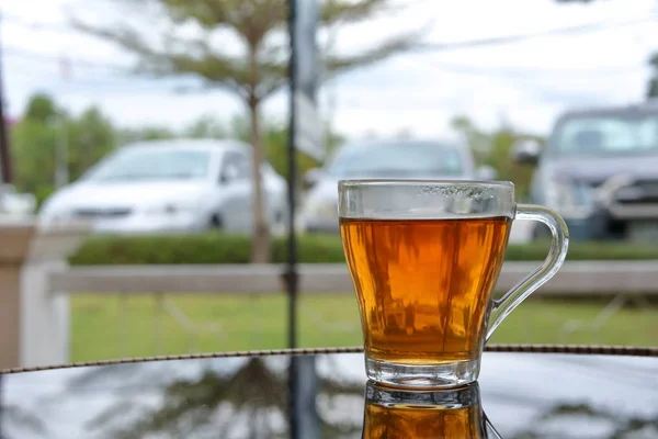 hot tea healthy drink put on glass table in the morning time