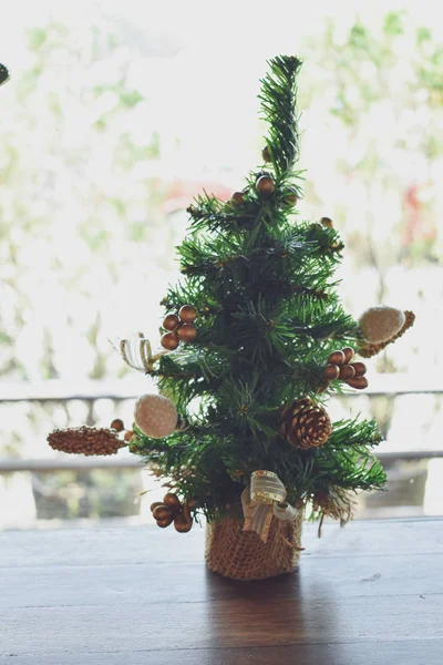 Christmas ornament decoration on small green pine tree — Stock Photo, Image
