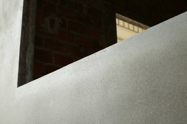 window frame on cement wall inside construction site building industry