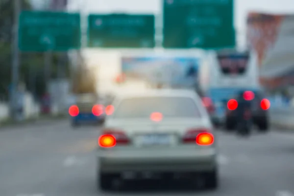 Car driving on urban road, image blur background — Stock Photo, Image