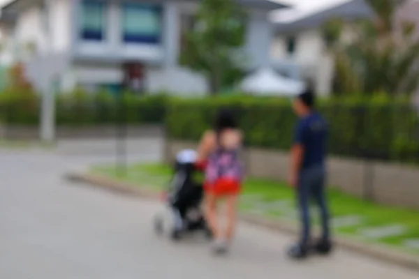 People walking on street of village house, image happy family concept with blur background — Stock Photo, Image