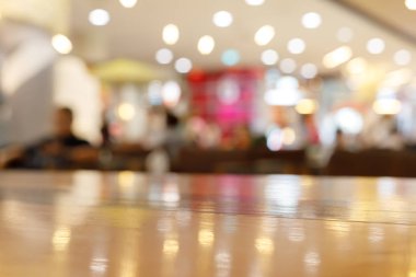 wooden table empty of display in cafe with luxury light decoration for dinner celebration