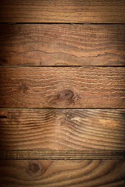 茶色の木製の納屋の壁の板のテクスチャの背景、古い木製のテーブルの上のビュー — ストック写真
