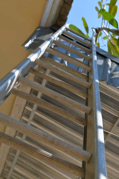 Ladder stair climb to roof house — Stock Photo, Image