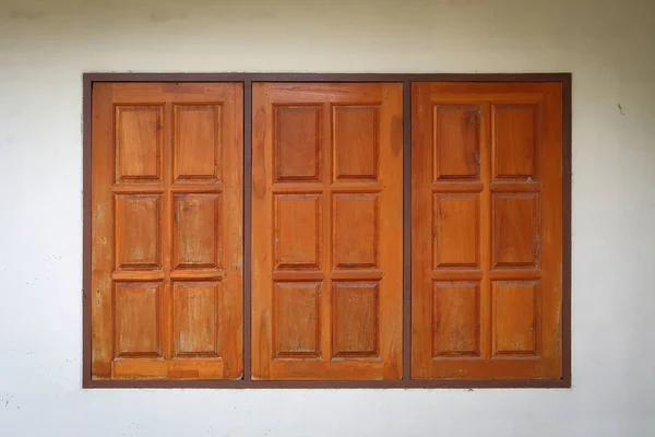 Wooden window closed on white wall residential house — Stock Photo, Image