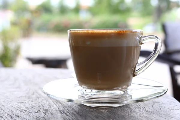 hot latte coffee put on wooden table in cafe restaurant, breakfast in morning day