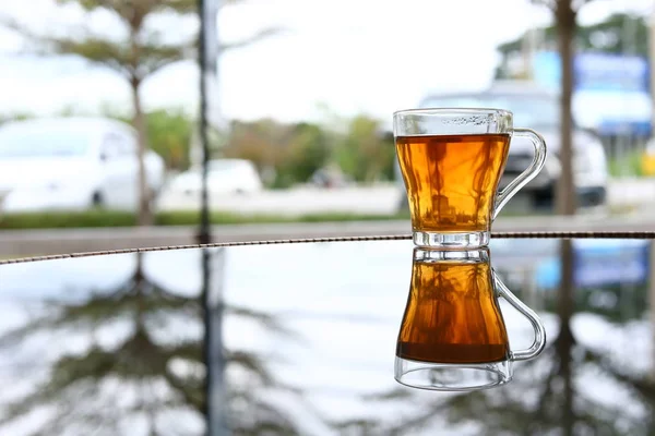 hot tea healthy drink put on glass table in the morning time