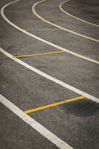 Black tarmac asphalt of running track, athletic sport background — Stock Photo, Image