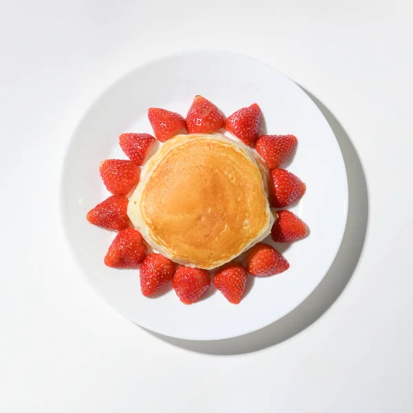 Cute pancake strawberry with sun shape on white background — 스톡 사진