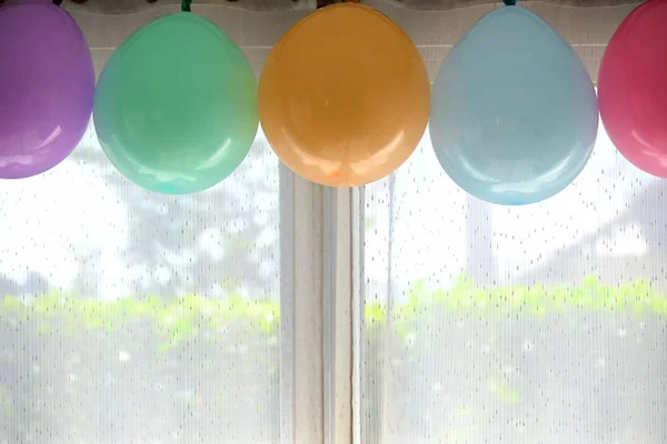 colorful pastel balloon hanging decoration in birthday celebration party inside home
