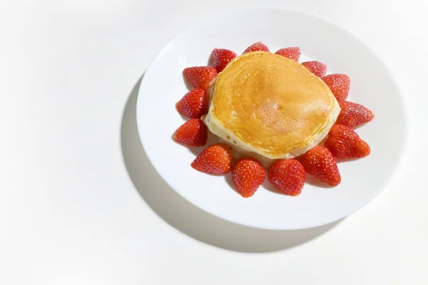 Cute pancake strawberry with sun shape on white background — Stock Photo, Image