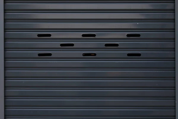 Black roller shutter door closed security background — Stock Photo, Image