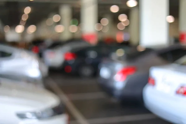 Parque de estacionamento no edifício de negócios, imagem borrão — Fotografia de Stock