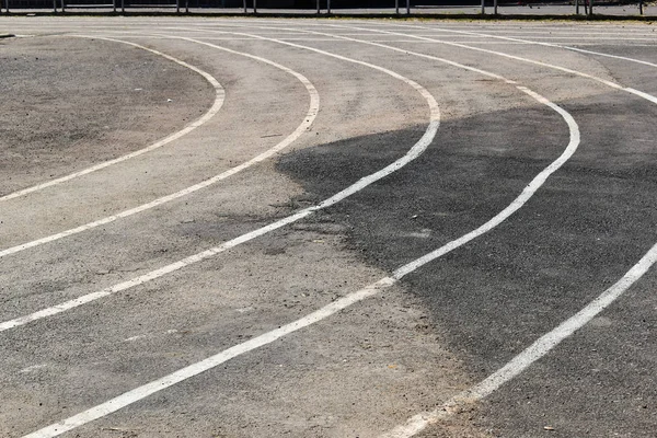 Black tarmac asphalt of running track, athletic sport background — 스톡 사진