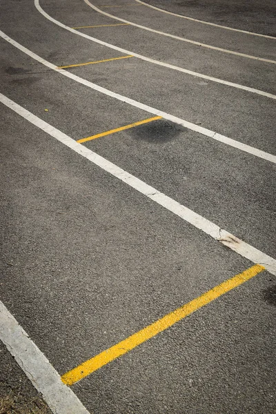 Black tarmac asphalt of running track, athletic sport background — Stock Photo, Image