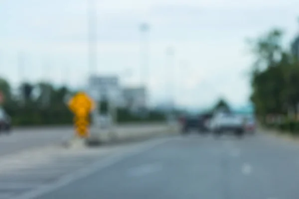 car driving on urban road trip travel, image blur background