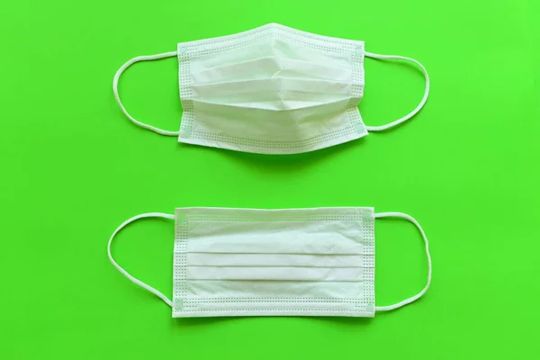 medical hygiene face mask on green background