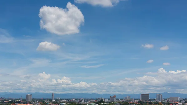 white cloud on blue sky above the town, aerial view cityscape