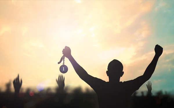 Winner Concept Silhouette Champion Hand Holding Gold Medal Reward Blurred — Stock Photo, Image