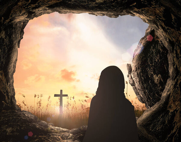 Resurrection Sunday of Jesus Christ concept: Tomb empty with cross at sunrise background